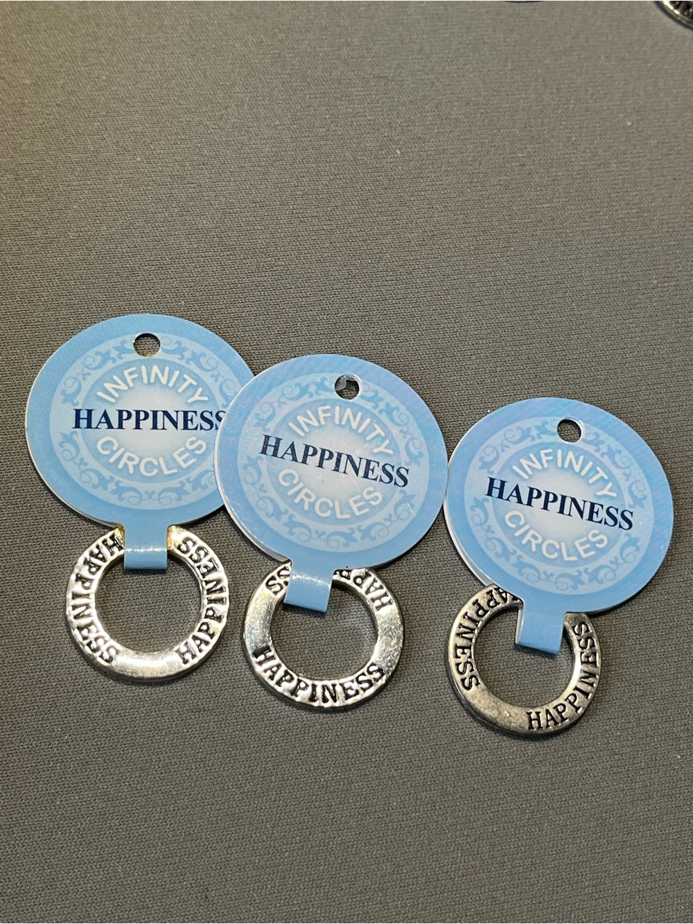 NWT four infinity circle imprinted with happiness.  Layered in sterling silver.